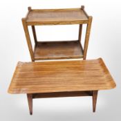 A teak and laminated wood curved coffee table, length 81 cm,