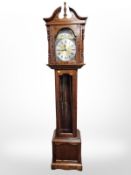 A reproduction Emperor Clock Company grandmother clock with moon phase dial, pendulum and weights,