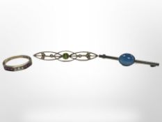 A 9ct gold ruby-set ring, a further peridot and seed pearl bar brooch, and a silver bar brooch.