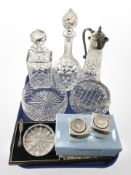 An EPNS-mounted glass claret jug, two crystal decanters, rose bowl,
