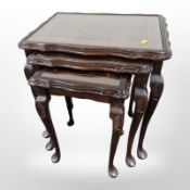 A nest of three inlaid mahogany tables,