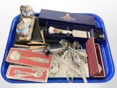 A group of boxed and un-boxed cutlery, ceramic cruet on silver plated stand,