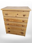 A contemporary pine four drawer chest,