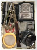 A group of various pens, trinket box, sunglasses, carved wooden chisel,