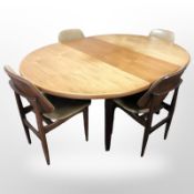 A 20th century teak oval extending dining table with leaf, 168 cm overall,