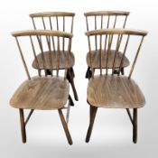A set of four Danish Farstrup stained beech spindle back dining chairs