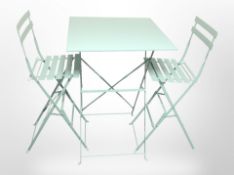 A contemporary folding painted metal patio table,