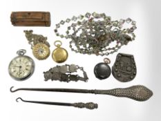 A gun metal sovereign case and a further gilt example, a horseshoe-shaped match vesta,