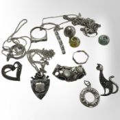 A group of silver jewellery comprising pendants, charms, marcasite cat brooch, fob, etc.