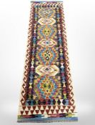 A Chobi Kilim runner, 208cm x 64cm.