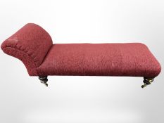 A Victorian style chaise longue with bolster cushion,