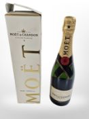 A bottle of Moët and Chandon Imperial Brut Champagne, 12% vol., 750ml, in carton.