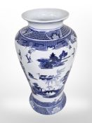 A Willow pattern blue and white porcelain vase,