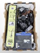 A group of vintage and modern cameras including Minolta SRT 100, Lumix DMC-G1,