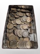 A tin of mainly George V pennies.