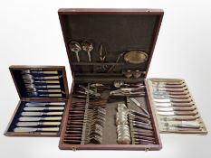 A teak canteen containing Thai brass and teak cutlery, a further set of glosswood knives and forks,