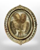 A 15ct gold black enamel memorial brooch with hair and pearls