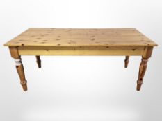 A contemporary pine farmhouse dining table,