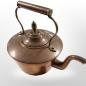 A Victorian copper and brass kettle.