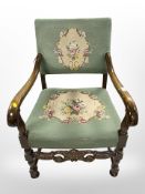 A continental carved beech armchair in tapestry fabric.