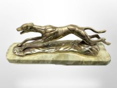 A brass figure of a running greyhound on onyx plinth, length 24cm.