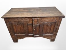 A George III blanket chest, with later carving and double doors to front,