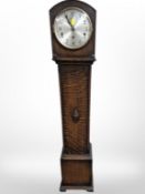 An oak Grandaughter clock, with silvered dial,