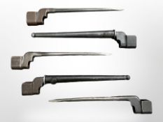 Five British No4 Mk II spike bayonets, two in scabbards.