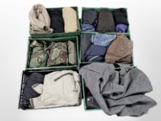 Assorted clothing including military camouflage gear, woolen coats,