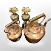 Two antique copper kettles together with a pair of heavy Indian brass urns and a trench art brass