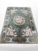 A Chinese rug on green ground,