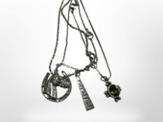 Three silver chain necklaces including one with faceted oval green stone pendant,