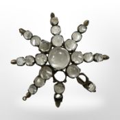 An antique moonstone costume brooch (three stone missing)