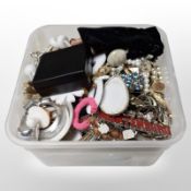 A small tub of mixed costume jewellery, faux pearls, bead necklaces, bangles, etc.