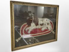 A needlework on felt relief picture of a spaniel seated on a cushion,