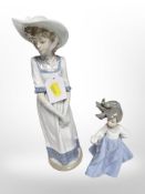 A Nao figure of a lady and a further figure of a girl.