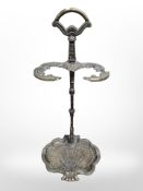 An ornate cast brass umbrellas stand,