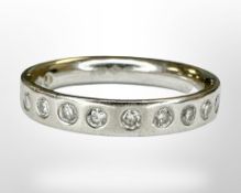 A platinum diamond half eternity ring, size H, 4.2g.
