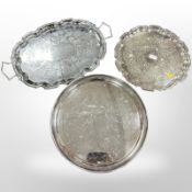 Three silver-plated serving trays, largest 55cm wide.