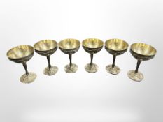 Six silver plated grape and vine pattern champagne glasses,