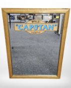 A mirror with applied Wills Cigarettes sticker,