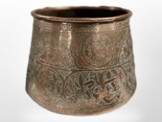 A Middle Eastern engraved copper vessel, height 14cm.
