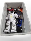 A remote-controlled robot toy and various remote-controlled cars.