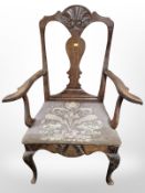 A 19th century carved oak armchair with tapestry seat