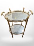 A gilt metal mirrored two-tier stand with lift off drinks tray,