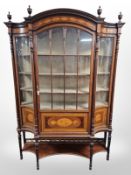 A late Victorian mahogany and satin wood inlaid inverted bow-front display cabinet,