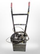 A sack barrow and an arc welder