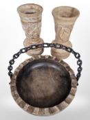 A pair of carved wooden vases,