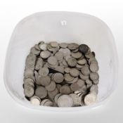 A tub of British pre-decimal coins, mostly two shilling pieces, crowns, etc.
