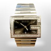 A Gentleman's Gucci wristwatch set with diamonds, the 58 diamonds approximately 1.4ct.